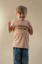 Child wearing a 'Cheeky Chimp' t-shirt against a plain background