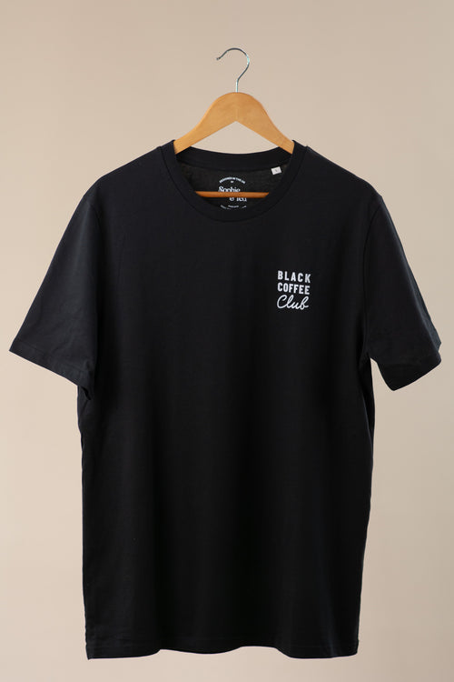 Black t-shirt with 'Black Coffee Club' text on a beige background