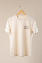 Beige t-shirt with 'Stretch and Fold' text on a beige background