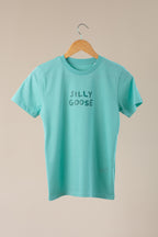 Turquoise t-shirt with 'SILLY GOOSE' text on a beige background