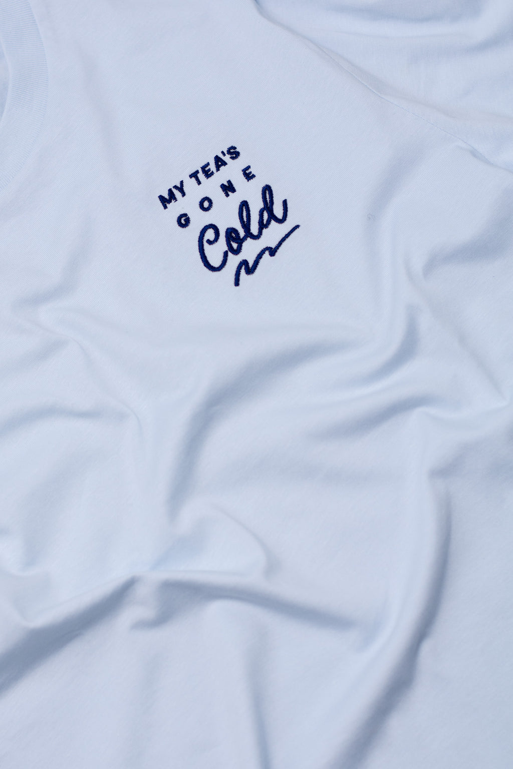 Light blue t-shirt with text 'My Tea's Gone Cold' on a white background