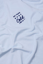 Light blue t-shirt with text 'My Tea's Gone Cold' on a white background