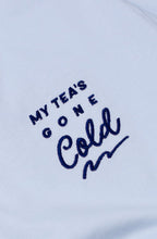 Light blue t-shirt with text 'My tea's gone cold' on a white background
