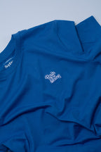 Blue t-shirt with white text on a light blue background