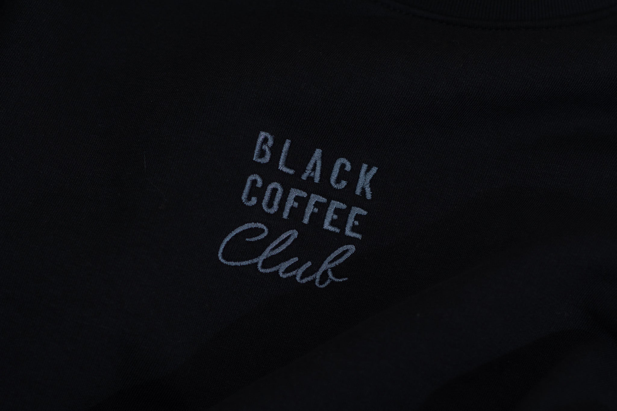 'Black Coffee Club' text on a black background
