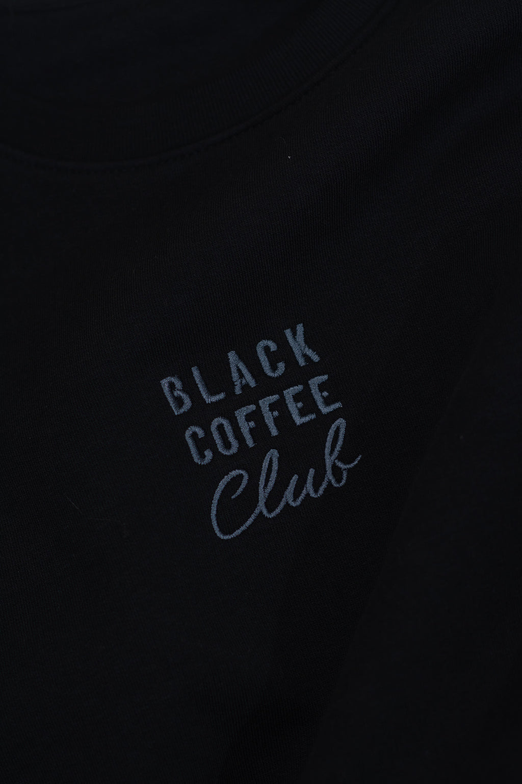 'Black Coffee Club' text on a black background