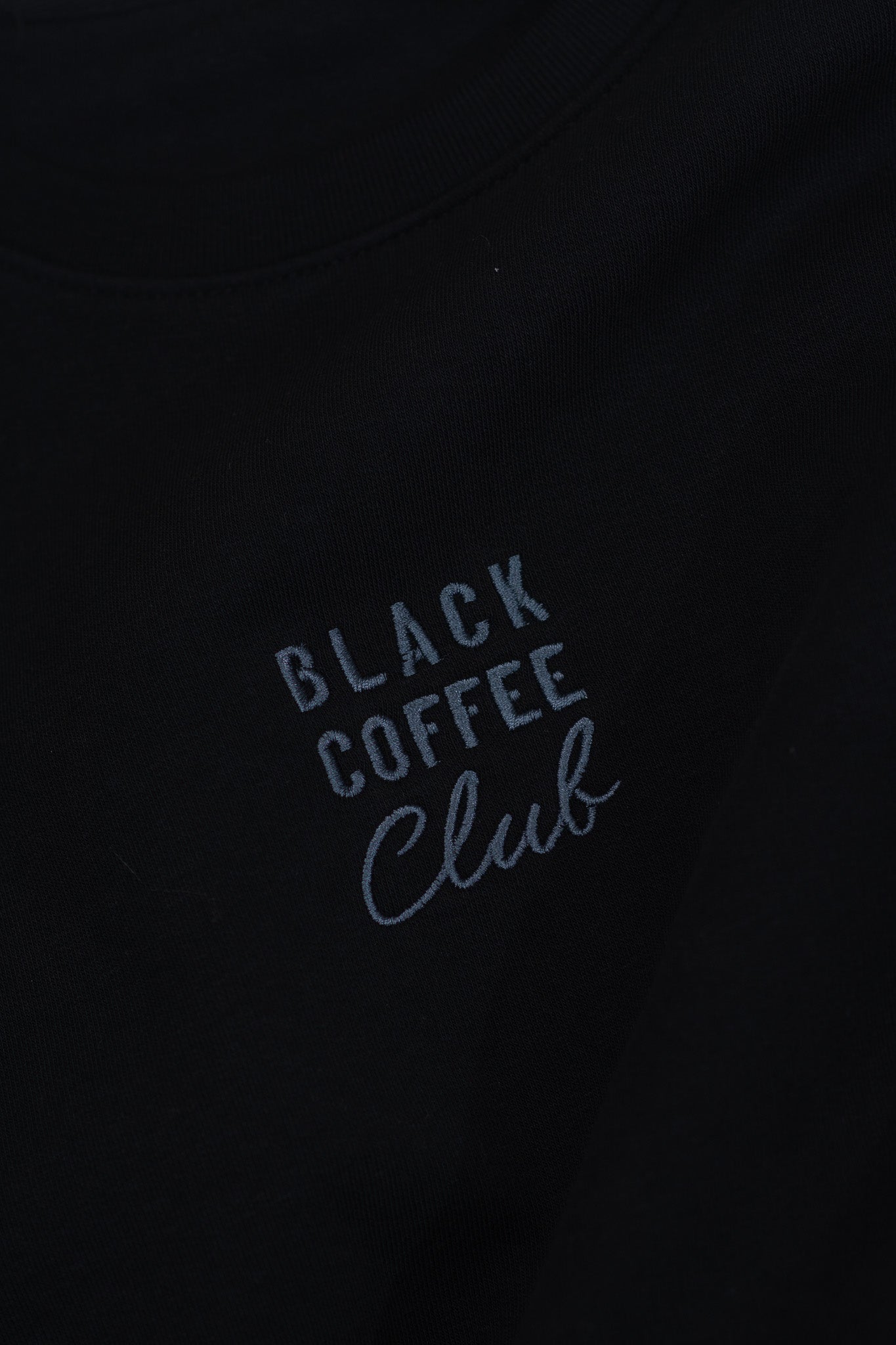 'Black Coffee Club' text on a black background