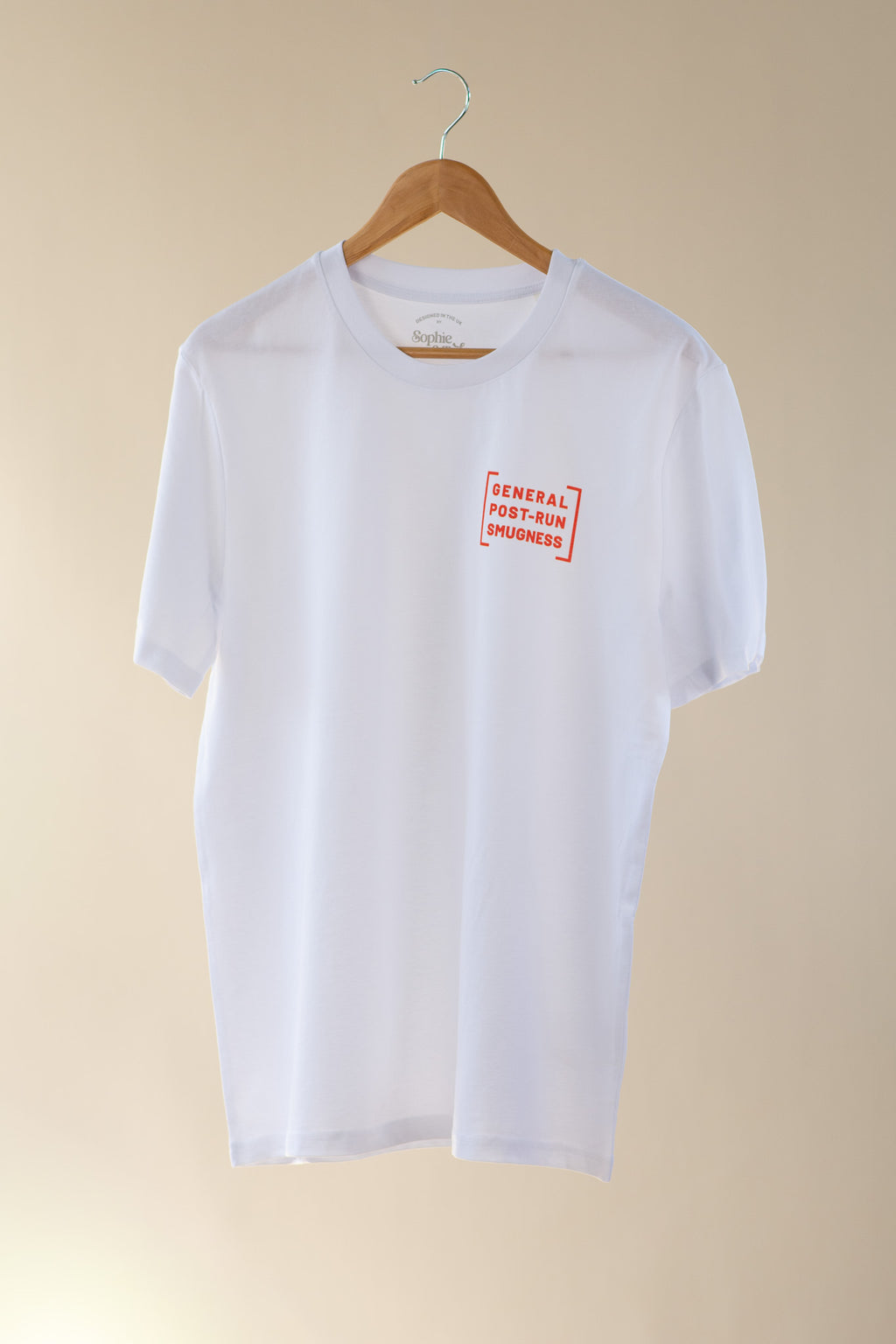 White t-shirt with a red logo on a beige background
