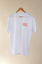 White t-shirt with a red logo on a beige background