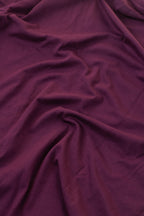 Close-up of purple fabric with folds