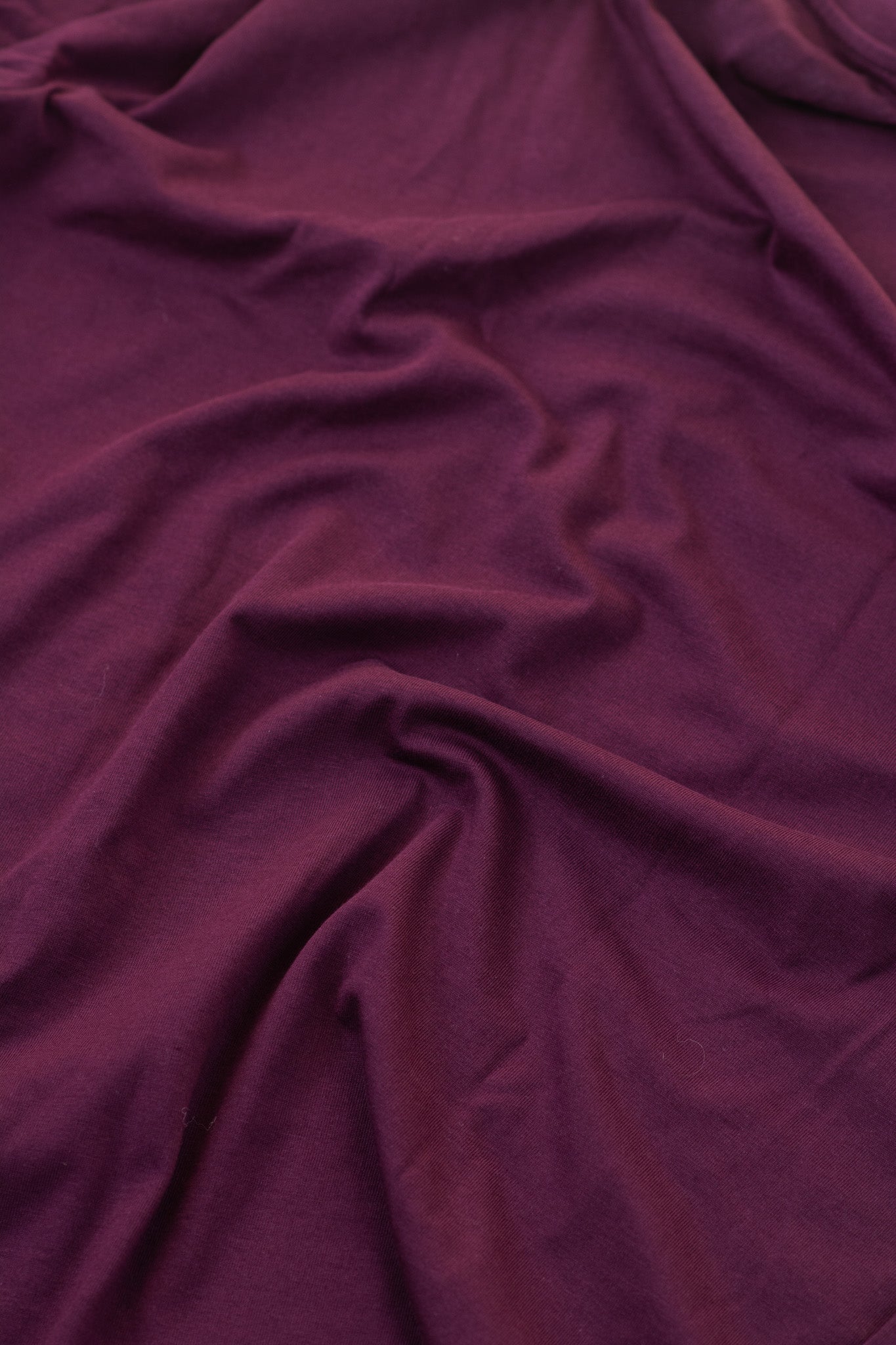 Close-up of purple fabric with folds