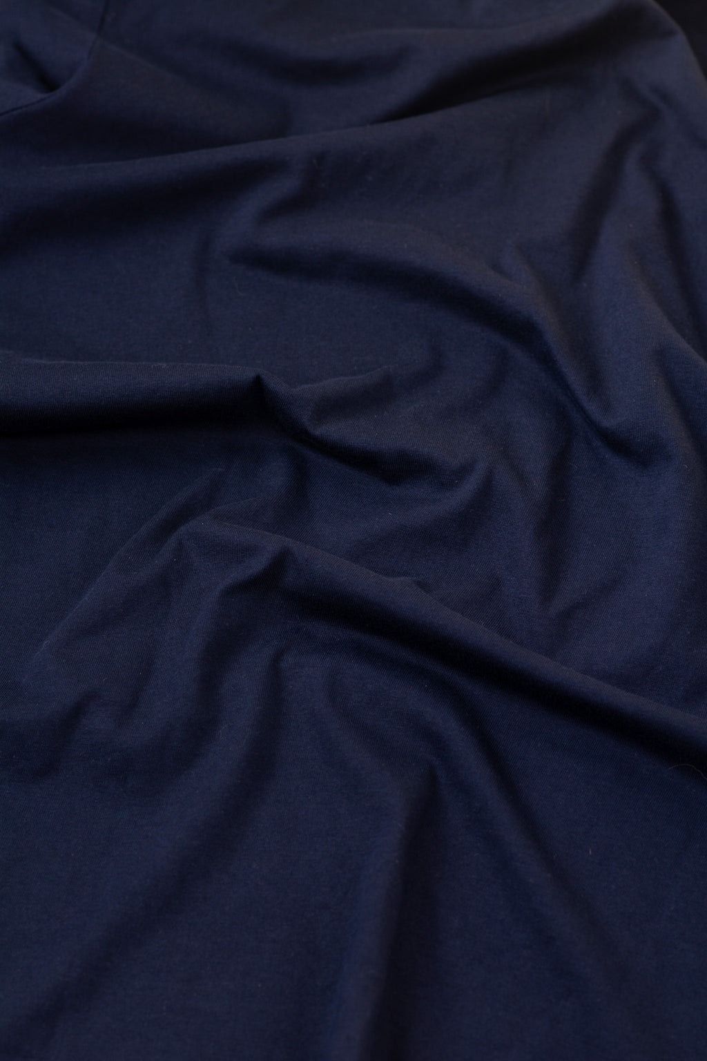 Navy blue fabric with folds