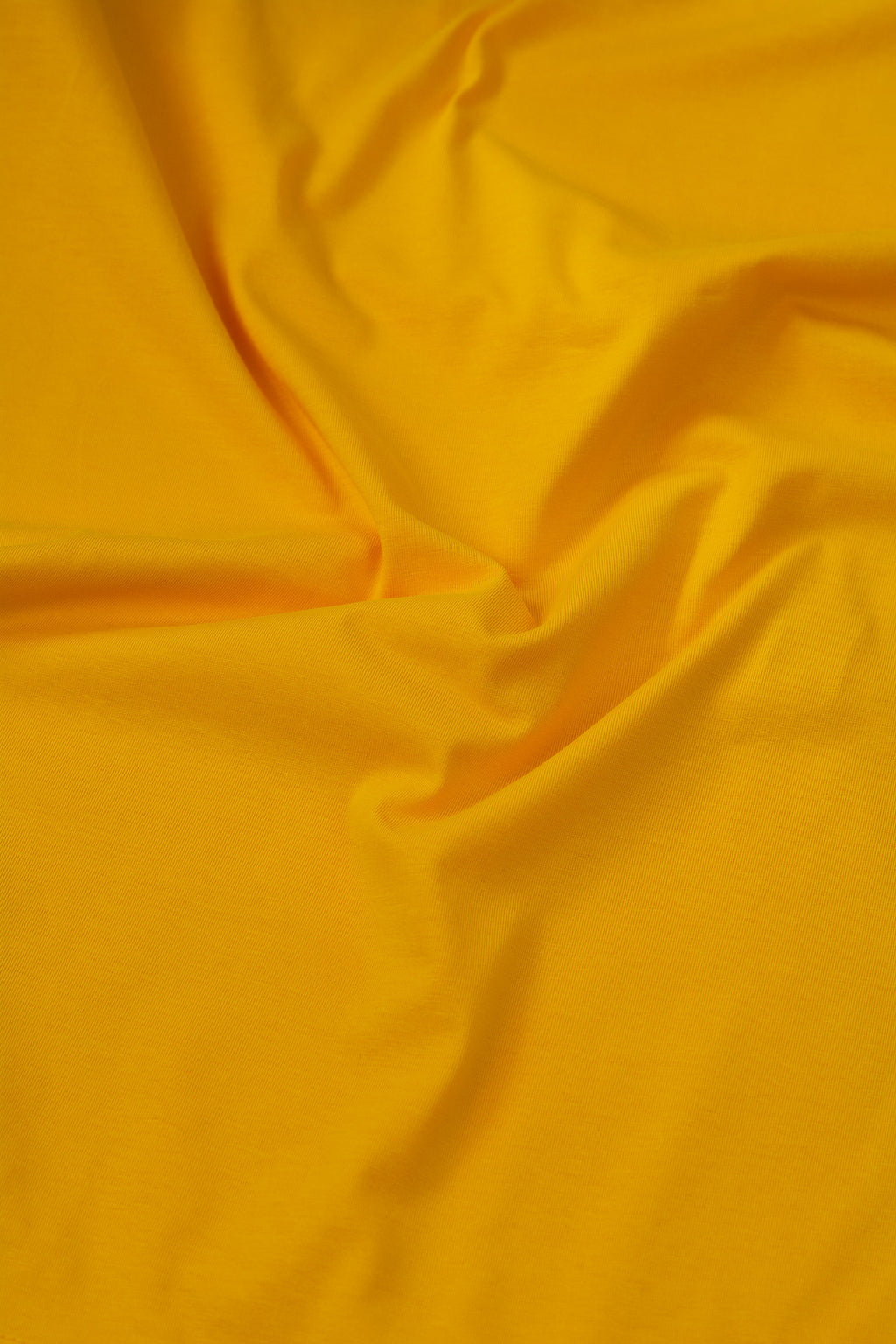 Close-up of yellow fabric with folds