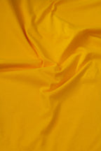 Close-up of yellow fabric with folds