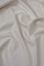 Close-up of beige fabric with visible texture