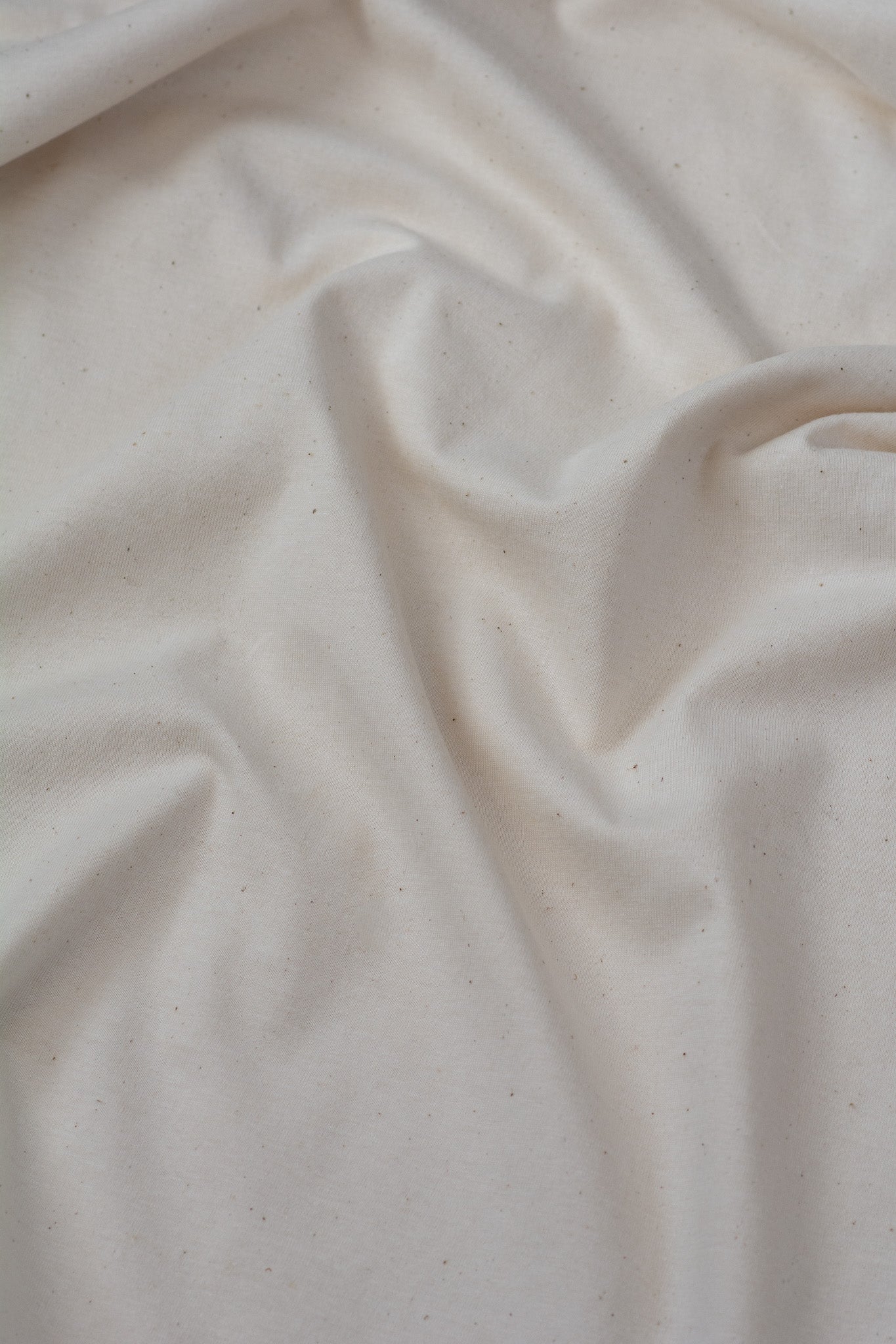 Close-up of beige fabric with visible texture