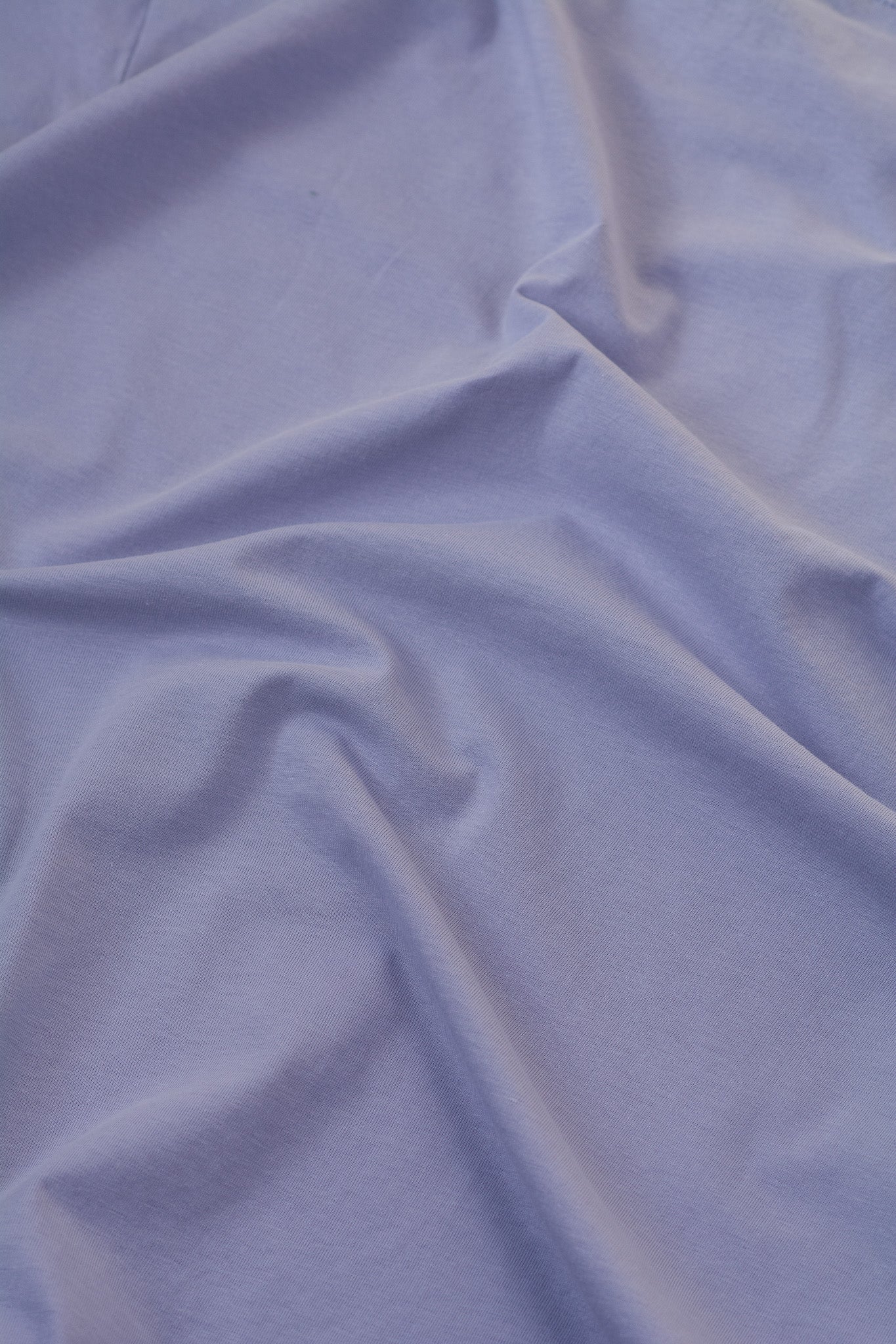 Close-up of light blue fabric with visible texture