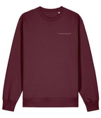 Maroon sweatshirt with 'unravelled' text on a white background